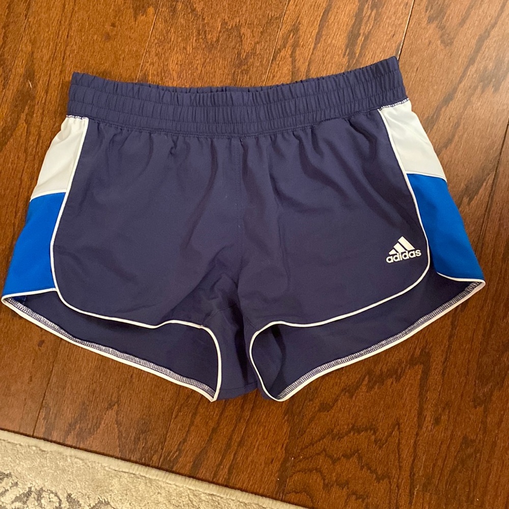 Navy, blue, and white adidas athletic shorts